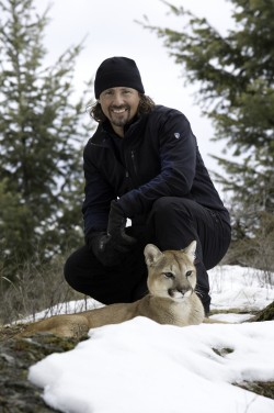 Casey Anderson in Kalispell, Mont., with Khia, a young female mountain lion — Photo courtesy of Grizzly Creek Films / Rick Smith