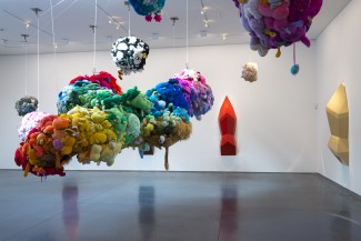 Mike Kelley. Deodorized Central Mass with Satellites. 1991/1999. Plush toys sewn over wood and wire frames with styrofoam packing material, nylon rope, pulleys, steel hardware and hanging plates, fiberglass, car paint, and disinfectant. Overall dimensions variable. (c) Estate of Mike Kelley.  Images courtesy of Perry Rubenstein Gallery, Los Angeles. Photography: Joshua White/JWPictures.com.