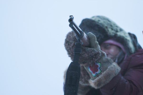 Sue Aikens, star of Life Below Zero, takes aim with her rifle in Kavik, Alaska — Photo courtesy of © 2012 BBC Worldwide Ltd. "All Rights Reserved" 