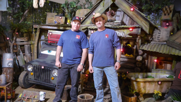 Ron and John Daniels stand in front of a recently constructed shooting gallery. Photo courtesy of Animal Planet.