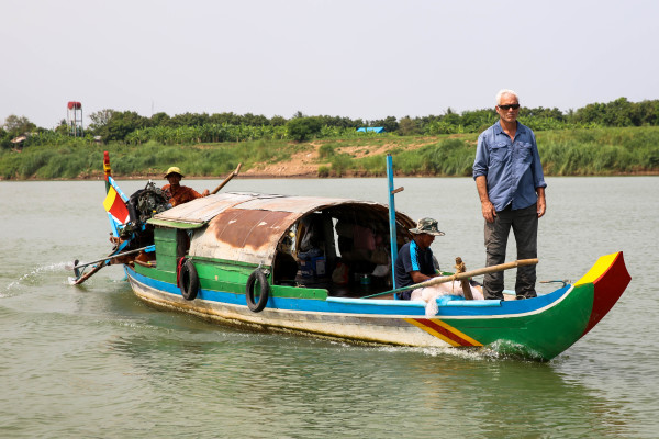 Jeremy Wade takes a ride on a river in Cambodia — Photo courtesy of Animal Planet