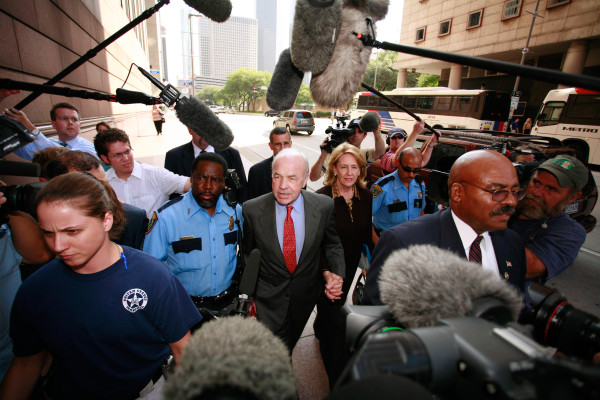 Former Enron Corp. Chairman Kenneth L. Lay and his wife Linda are escorted from the the Bob Casey Federal Courthouse Monday May 1, 2006, in Houston, Texas, for the fraud and conspiracy trial against Lay and Jeffrey Skilling . The government continued their cross-examination of Lay on the witness stand. Photo courtesy of F. Carter Smith/Bloomberg News.