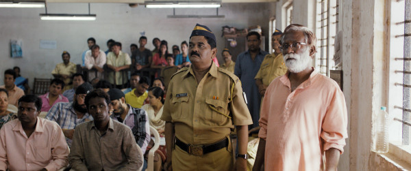 Vira Sathidar (right) stars as Narayan Kamble in Court, a film by Chaitanya Tamhane. Photo courtesy of Zeitgeist Films.