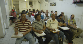 Taxi drivers attend a tutoring class in Frederick Wiseman’s In Jackson Heights. Courtesy of Zipporah Films.