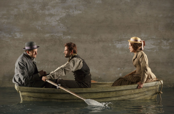 From left, Gabriel Ebert, Matt Ryan and Keira Knightley take a row on the watery stage of Studio 54. Photo courtesy of Joan Marcus.