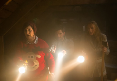 From left, Linda (Allison Tolman), Tom (Adam Scott) and Sarah (Toni Collette) need to find and kill Krampus in Legendary Pictures' Krampus, a darkly festive tale of a yuletide ghoul that reveals an irreverently twisted side to the holiday. Photo courtesy of Steve Unwin.