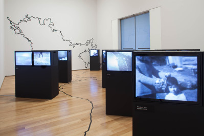 Juan Downey. Video Trans Americas. 1973-76. Fourteen-channel video (black and white, sound; duration variable) and vinyl map. Installation view, Transmissions: Art in Eastern Europe and Latin America, 1960–1980, The Museum of Modern Art, New York, September 5, 2015–January 3, 2016. The Museum of Modern Art, New York. Acquired through the generosity of the Latin American and Caribbean Fund and Baryn Futa in honor of Barbara London. © 2015 Estate of Juan Downey & Marilys B. Downey. Digital image © 2015 The Museum of Modern Art. Photo: Thomas Griesel