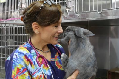 Dr. Susan Kelleher holds Piper, the orphaned rabbit she rescued. Photo courtesy of National Geographic Channels/Tim Kling.