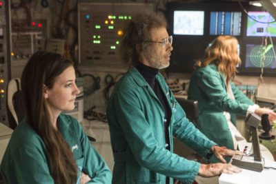 From left, Joey (Stephanie Allynne) helps Dr. Roberts (Jon Gries) perform his exam. Dream Corp LLC premieres Sunday, Oct. 23 on Adult Swim. Photo courtesy of Adult Swim.